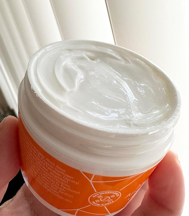 The open tub of cream