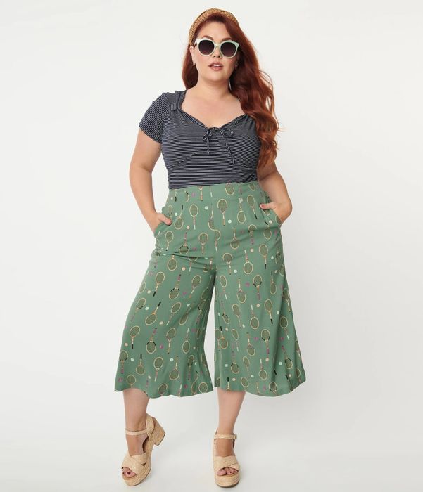model standing front-facing in green culottes