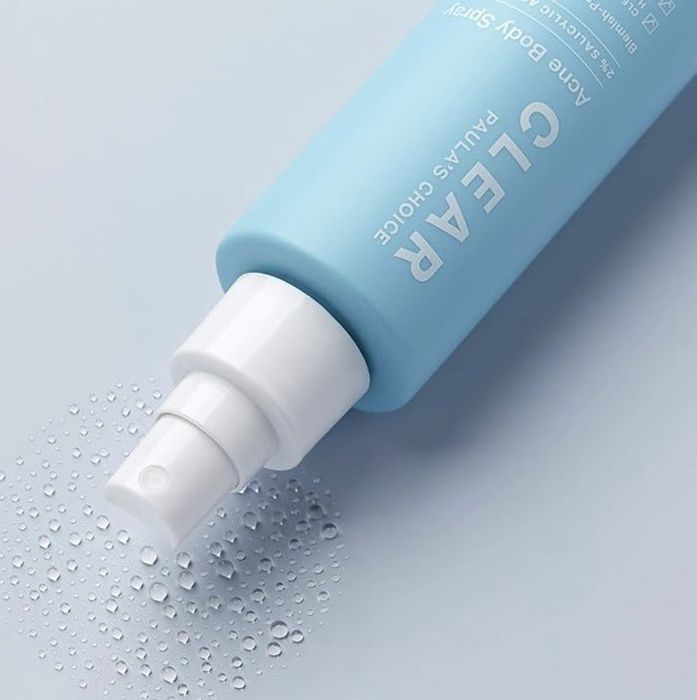 Bottle placed on a surface with sample droplets