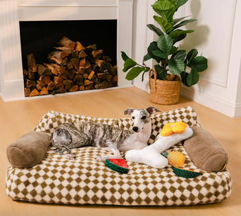 A dog bed featuring a brown and white checkered design