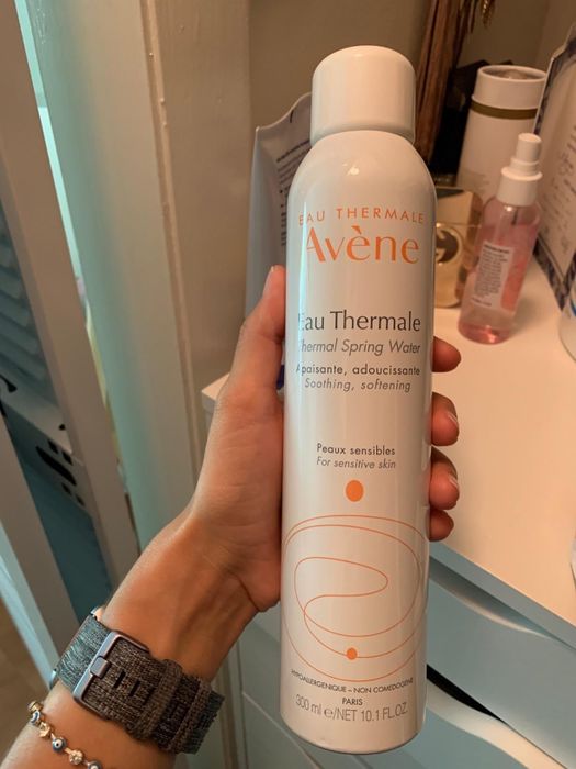 Image of a reviewer holding up the spray bottle