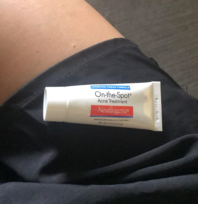 Image of the spot treatment tube placed on a reviewer's leg