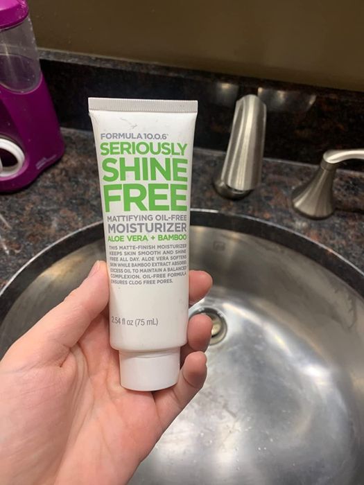 image of reviewer holding the moisturizer
