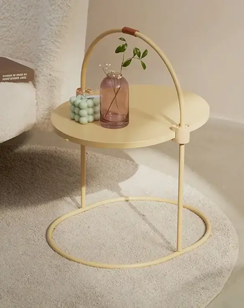The scratching pad functioning as a stylish side table