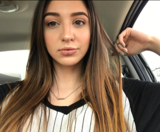 A reviewer with flawless, glowing skin