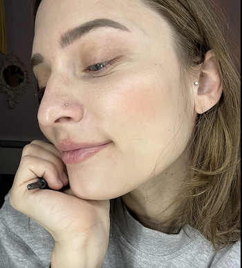 Reviewer showcasing their hydrated skin