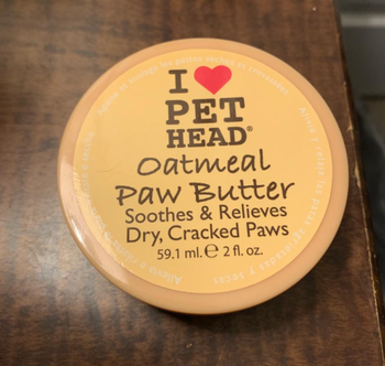 A reviewer’s photo showcasing the jar of oatmeal paw butter.