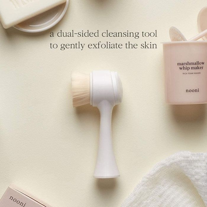 The brush in a sleek white design.