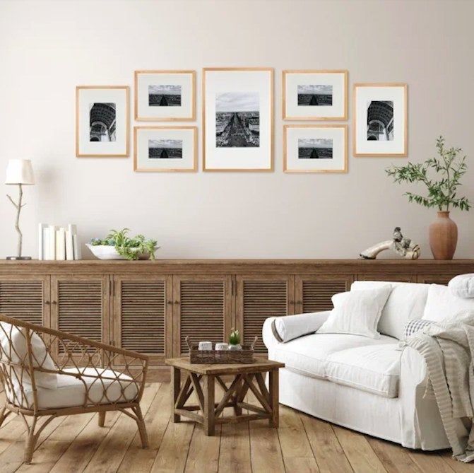 Wooden gallery frames displayed on a wall in a living room