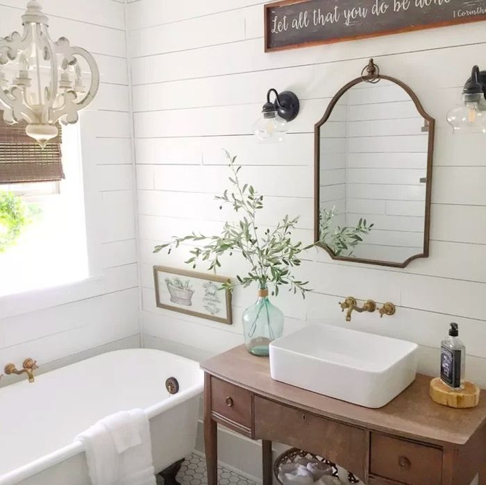 An image of the mirror hanging in a bathroom.