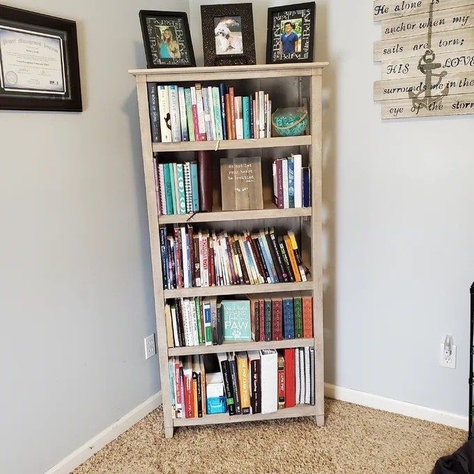 Tan bookcase filled with books