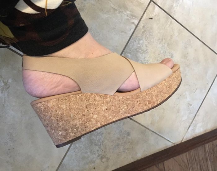 Stylish beige wedge sandals, combining comfort and elegance in one.