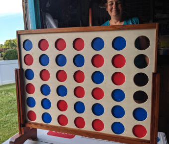 A giant Connect Four game set up for a fun outdoor challenge.