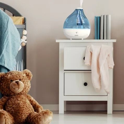 A humidifier resting on a nightstand