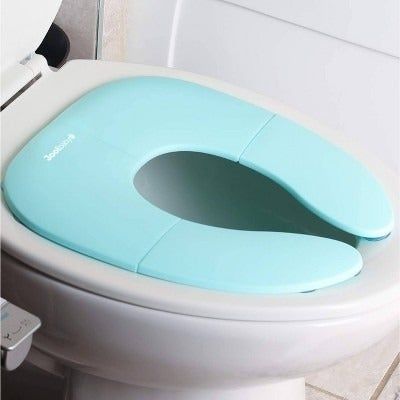 Travel potty seat placed on a toilet