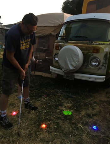 Another reviewer testing out the golf set in their backyard.