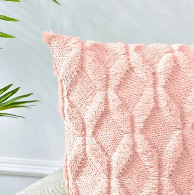 A close-up view of a pink throw pillow.