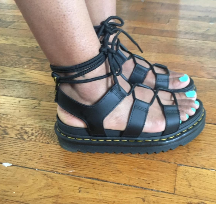 The reviewer showcases their photo, confidently standing in sandals.