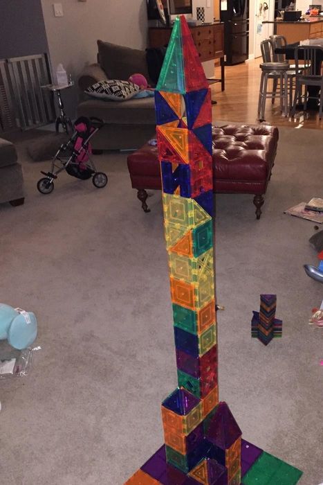 A tower-like structure made using colorful magnetic tiles