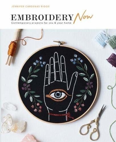 The book’s cover featuring beautiful embroidery designs.