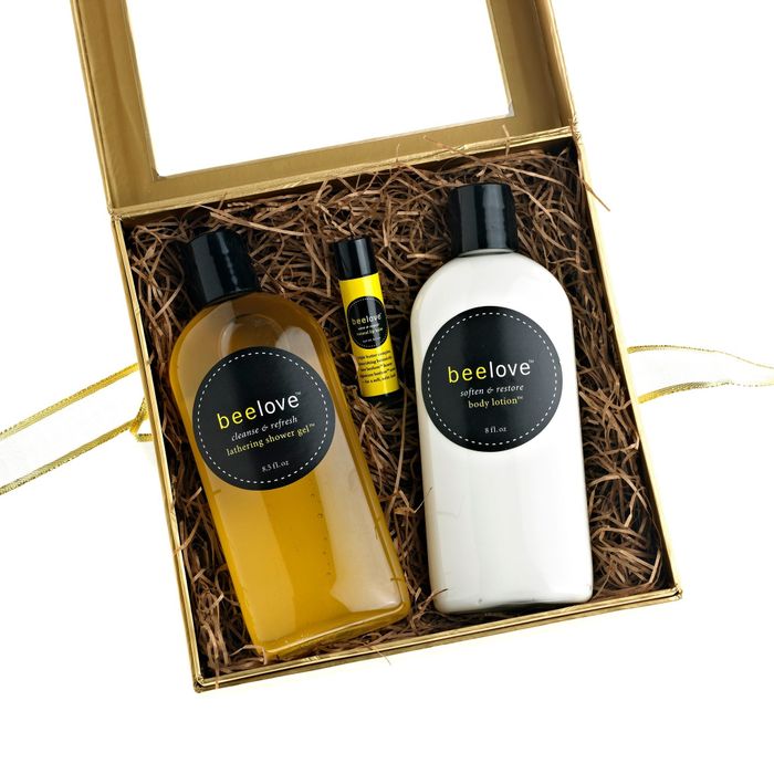 A Beelove gift box containing shower gel, body lotion, and lip balm