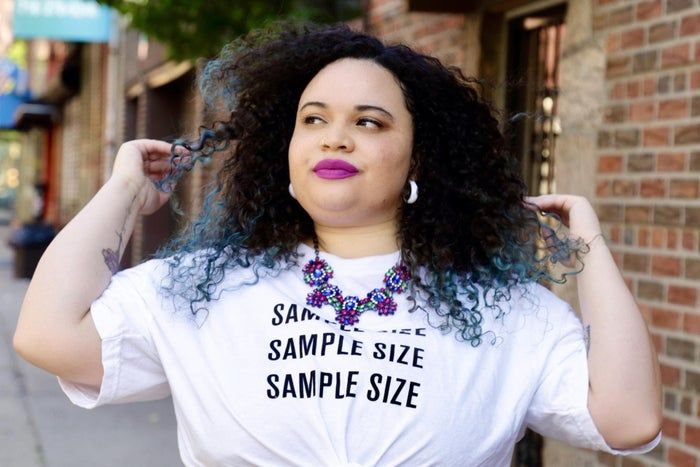 Kayla sporting a pinkish-purple matte lipstick