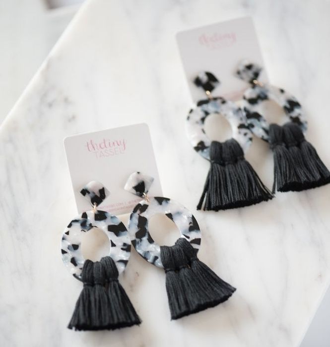 The same earrings, now with black tassels.