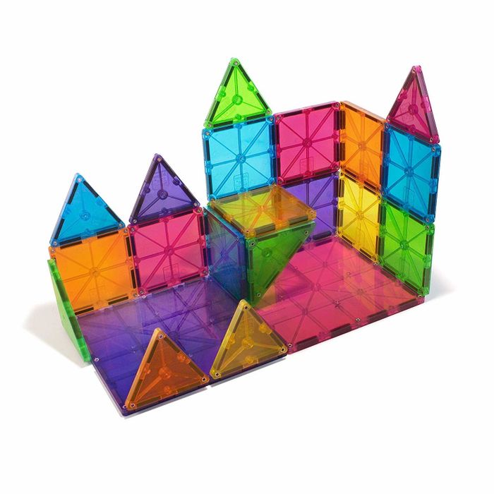 A colorful array of square and triangular magnetic tiles stacked into a tower