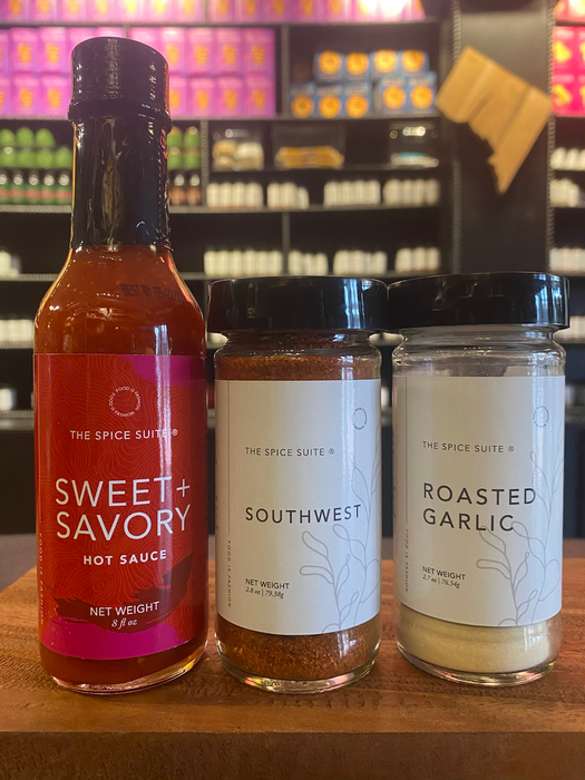 A collection of hot sauce, southwest spice blend, and roasted garlic spice mix.