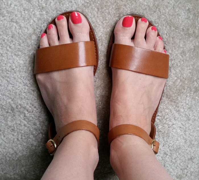 Tan sandals with thick straps.