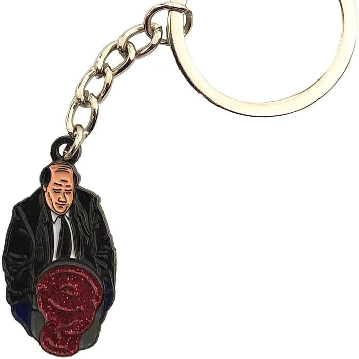 A keychain featuring Kevin Malone spilling a glittery vat of chili.