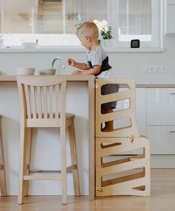 A child enjoying the learning tower.