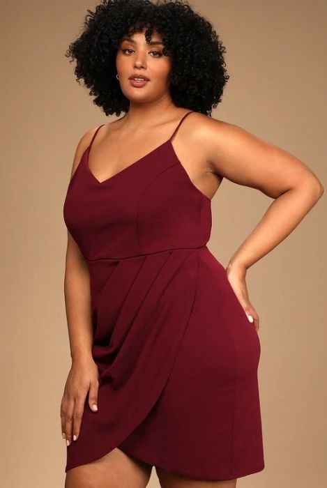 An image of a model wearing a wine-colored bodycon dress made from a lightweight, stretchy knit material