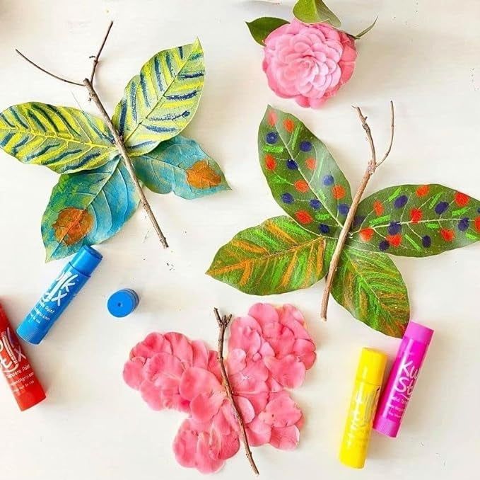 The red, blue, yellow, and pink paint sticks in the set.