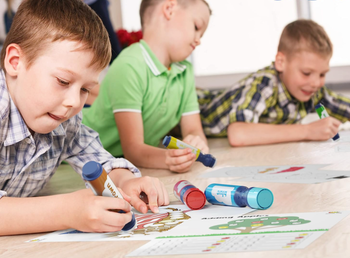 Kids happily drawing with the washable markers.