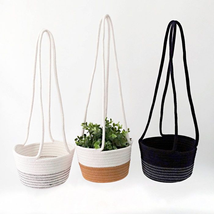 A white, tan, and black hanging basket for your plants.