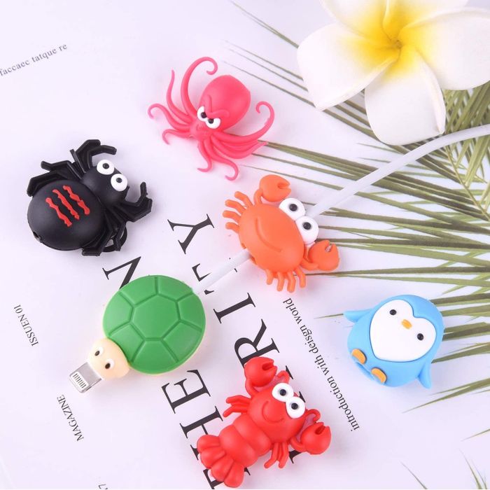 A set of cable-protecting animals, including a crab, lobster, turtle, penguin, and more, each with their own quirky charm.