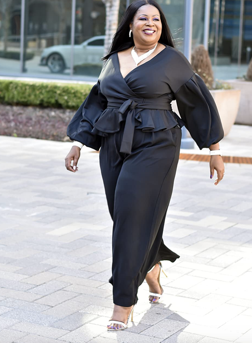 A reviewer styled in the black pants