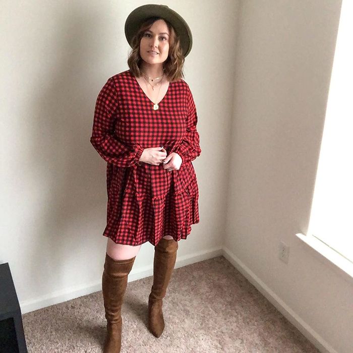 Reviewer in a plaid dress