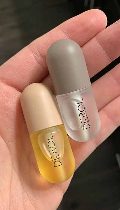 A reviewer showcasing lip plumpers in use