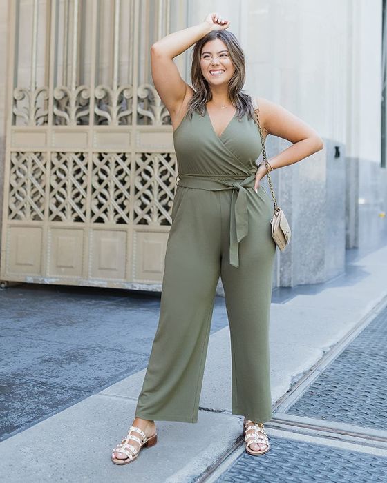 Model showcasing a stylish olive green jumpsuit.