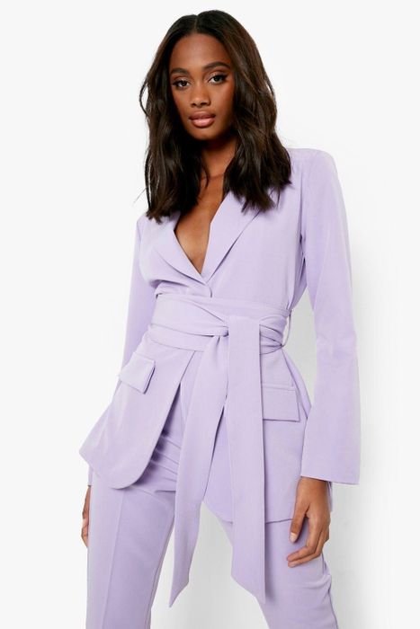 A model showcasing the lilac blazer.