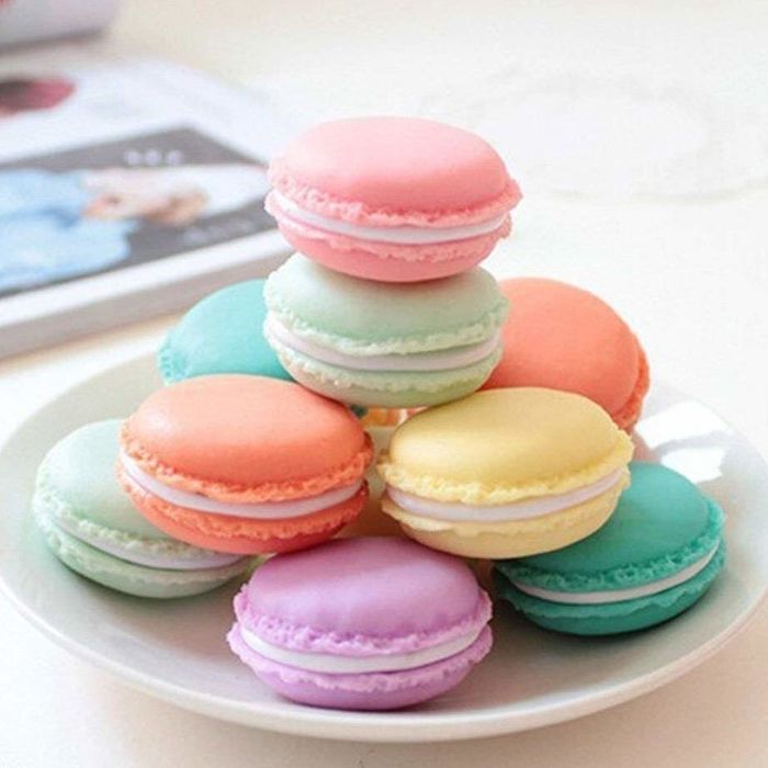 a plate of colorful plastic macarons