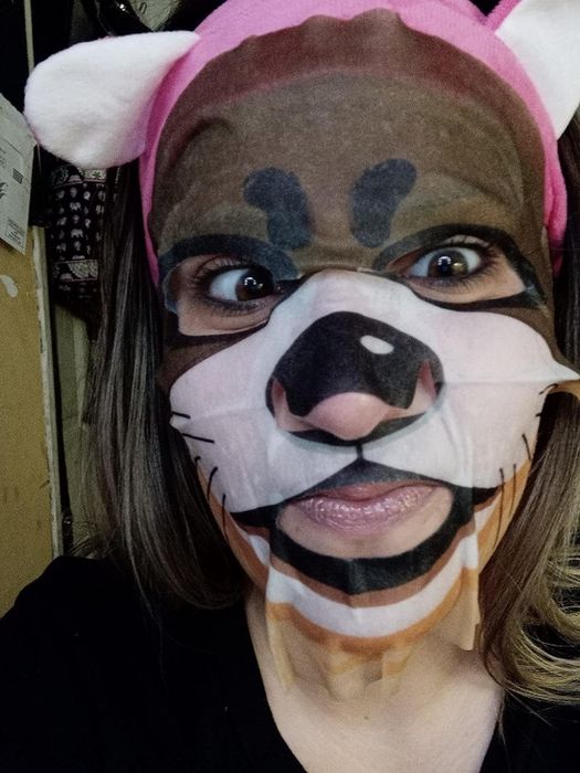 reviewer sporting a dog-shaped face mask