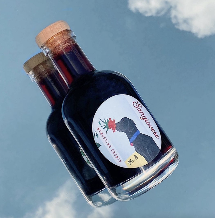 A bottle of Sangiovese featuring an adorable illustrated label with a dog.