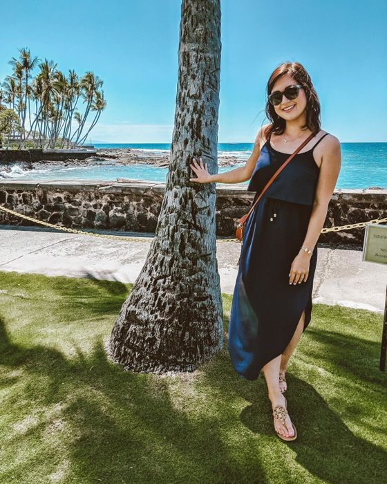 Reviewer in a navy blue dress