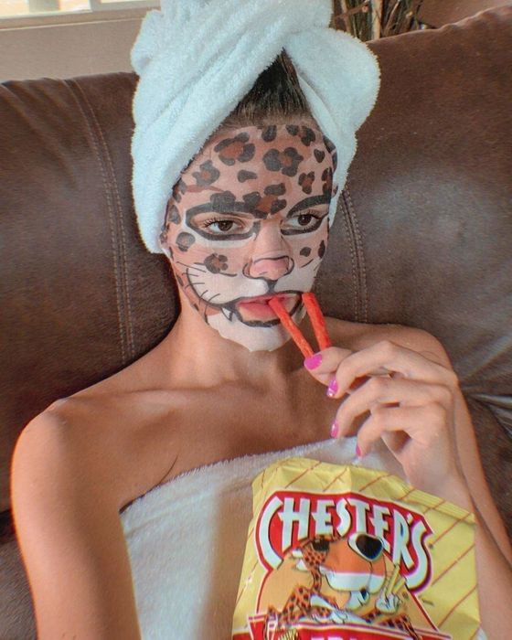 model wearing a leopard print face mask