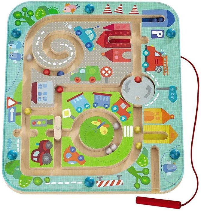A toy that allows kids to guide magnetic marbles through a maze using a stylus