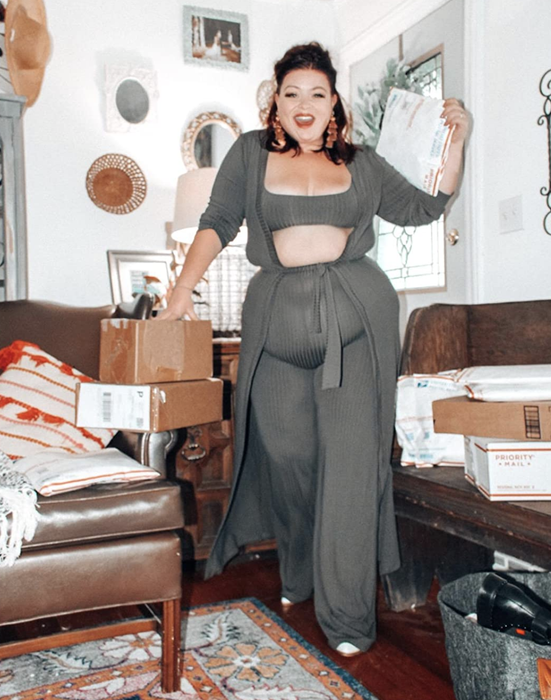 The reviewer is wearing a gray set of loungewear.