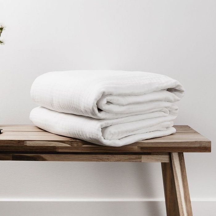 The blankets, offering comfort and cozy warmth.